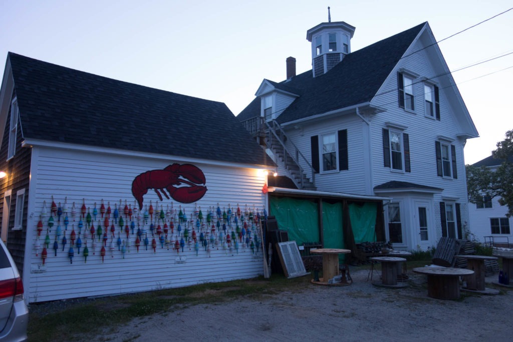 Acadia: Lobster Buoys on Wall in Stonington